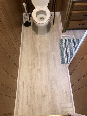 New baseboards, flooring and new toilet! Bathrooms are not always glamorous but this one turned out awesome!