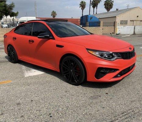 2020 kia optima wrapped in matte red paint