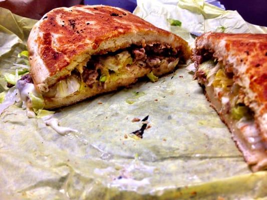 Carne Asada Torta, stuffed with meat and the bun is light, buttery and grilled.