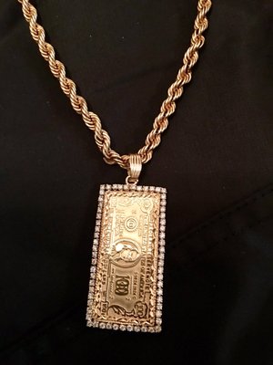 14KT GOLD $100 Piece with a total weight of 1 Karat of sparkling diamonds.