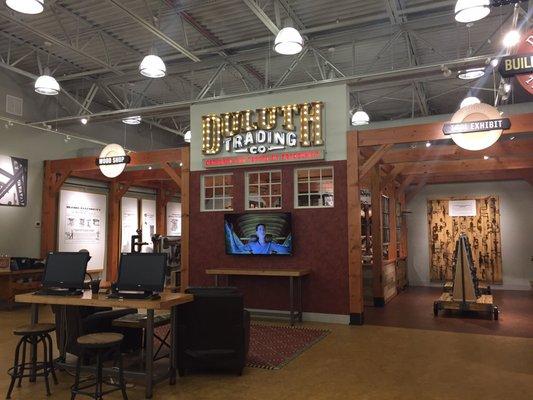 A small wood shop and tool exhibit near the complimentary coffee and water.