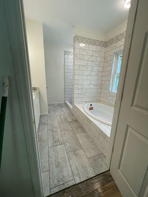 New construction master bathroom tile installation