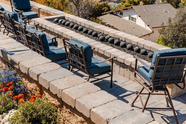 Retaining wall with molti stone cap and 15' custom firepit.