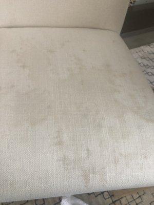 Wine spilled spots on a nice white dining room chair.