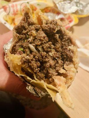 Carne asada burrito with rice, beans, cilantro, onion