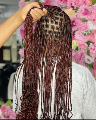 Burgundy knotless box braids. Waist length.