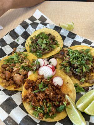 Pastor, steak, chicken, & chorizo tacos with no onion at my request.