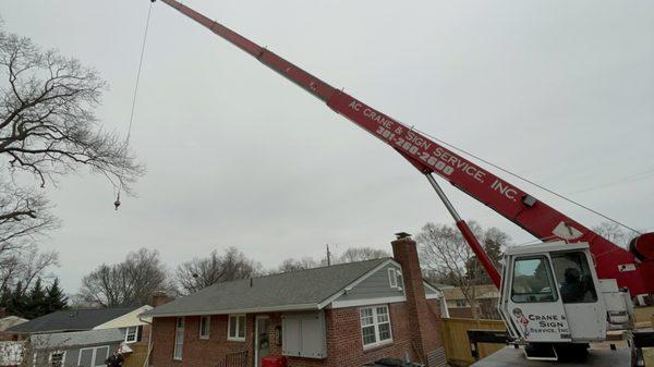 Crane prepping to move shed.