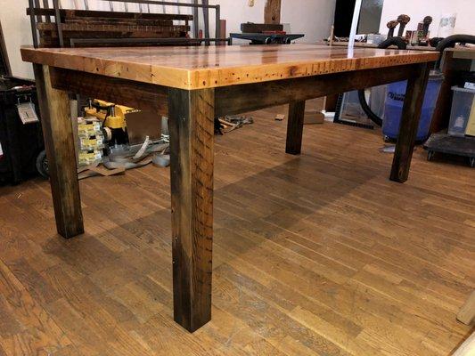 View of legs on reclaimed fir dining table