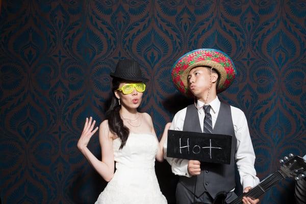 photobooth with an awesome backdrop and LOTS of fun props