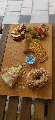 Romys favorite melt brie with honey and almond seasonal fruits crackers .