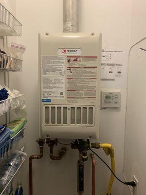 Tankless Water Heater replaced with a new Noritz tankless water heater inside a closet in the house in Brentwood. April 13-2022