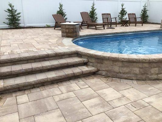 Semi-Pool Wall
Raised patio landing with staircase 
2 custom waterfall piers