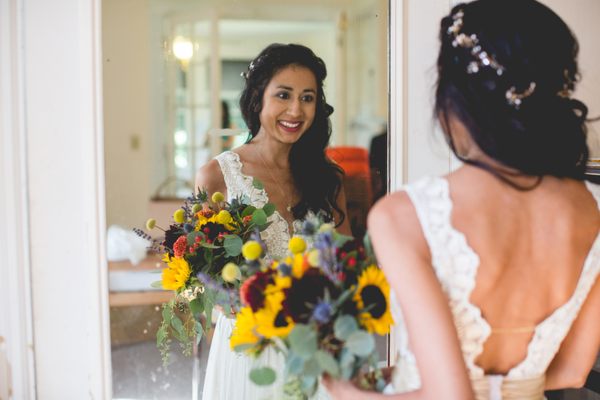 wedding hair done by Anna, she did a half up with a golden/pearl hair vine and wove pieces of hair around it