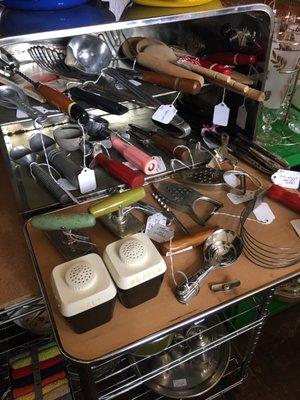 Bread box full of vintage utensils