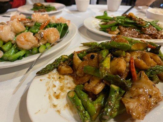 Front dish: Asparagus w/Beef  LR: "Hard" Gai Lan (Chinese broccoli) cooked with shrimp.  RR: Snow peas with beef.