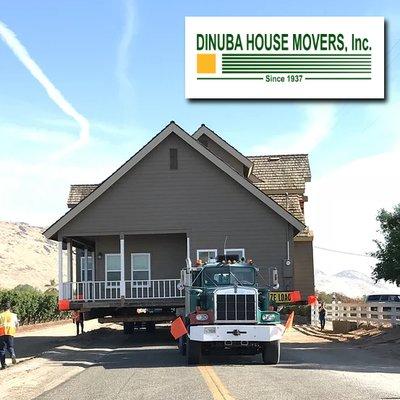 Dinuba House Movers pulling a house down the road to it's new location.