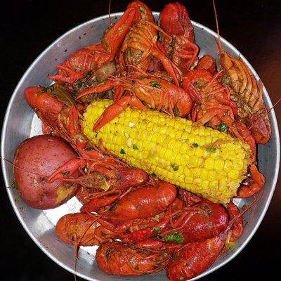 Viet-Pinoy-Cajun Crawfish with sides of boiled corn and potatoes