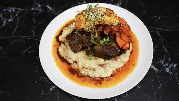 braised short rib and lobster over mash with a red pepper au juice