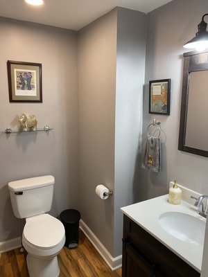 Half bath remodel, vinyl flooring, new light fixtures, sink vanity, drywall/taped and painted.