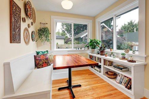 Remodel of a long, skinny kitchen creating an eating nook at the back