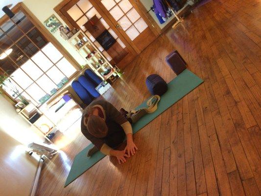 Long-time student Kathleen in ardha gomukhasana.