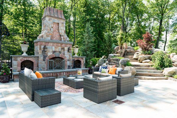 Terracare designs stunning patios with features such as this magnificent outdoor fireplace to make evenings outside unforgettable.