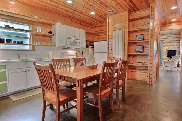 Four bedroom, 3.5 bath Cottage with a community pool.  Knotty pine walls and stained concrete floors! Great rental!