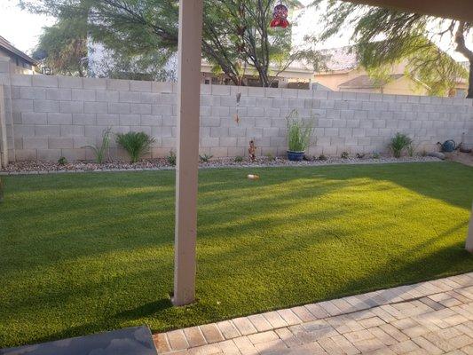 Turf installed to maximize play area for kids while keeping a small landscape and garden area for the adults