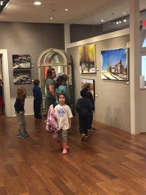 Students checking out the art in the gallery