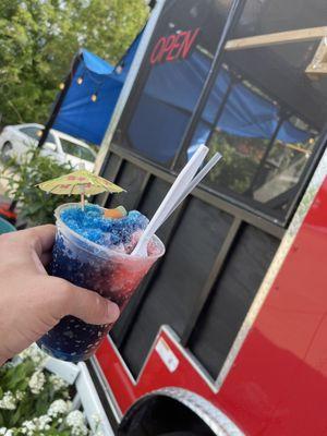 Blue raspberry n tiger blood shaved ice !!! With a tiki umbrella