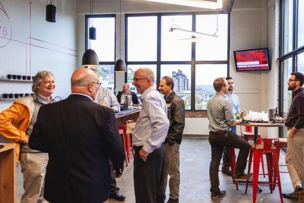 Employees and guests enjoying our cafe space during an open house.