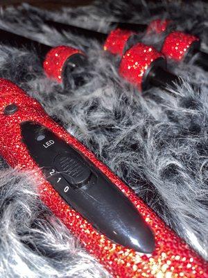 Luxury bedazzled wand that includes six detachable barrels, available in rainbow colors, black, and silver.