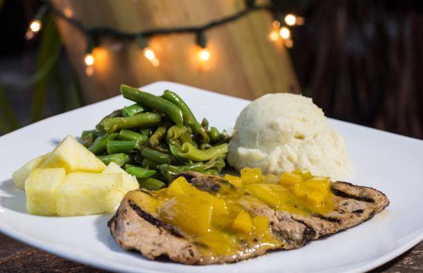 Pork with mango sauce, mashed potato and green beans