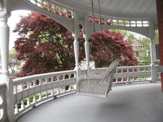 The beautiful sleeping porch shows off the Queen Anne style of the 1880's.