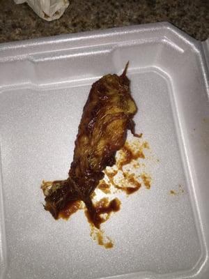 I heard of fresh chicken wings but come on...take the feathers off before you fry the wing...