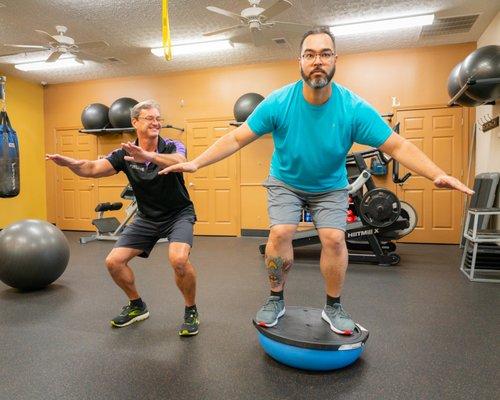 Tim coaching Joe during a training session.