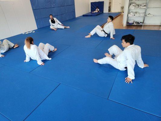 Us doing yoga for bjj after class