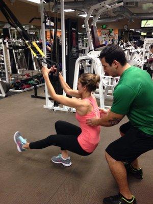 Spotting my client making sure she has correct form for all her exercises.