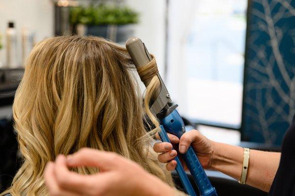 Create beach waves 
1)Apply Creative Styling Mist 
2) blow dry
3) Using a curling tool, start 2" away from scalp, wrap, leaving ends out