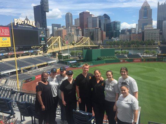 Volunteering at PNC Park with Team Smile, providing dental care for area kids in need