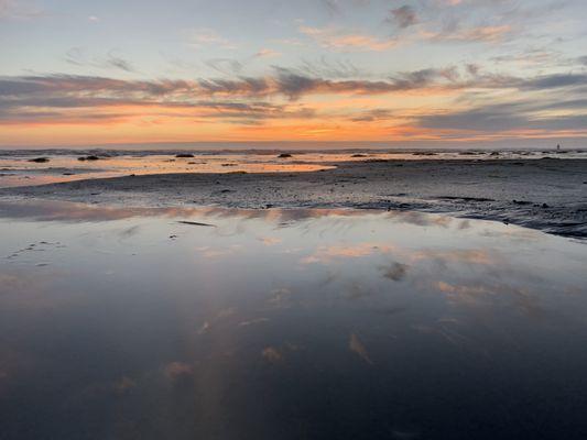 Stunning sunset reflecting on a tide pool