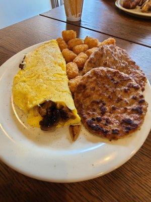 2 egg omelet comes with tots and toast, added a side of sausage. Very good.