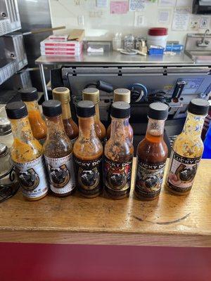 Lucky Dog Hot Sauce! On the counter at Extreme Pizza Novato! This sauce is award winning and makes every bite of pizza extremely delicious!