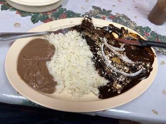 Enmoladas de mole negro Paired with rice and beans.  10/10