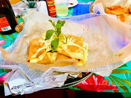 Cilantro lime shrimp roti - cilantro lime shrimp and rice wrapped in a crepe and drizzled with a cilantro lime sauce. DELISH