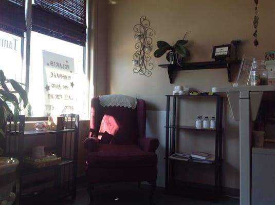 There are two super-comfy wingback chairs & plenty of reading material to keep you busy while you wait for your turn at massage heaven.