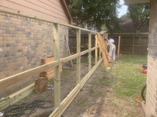 Installation of middle rail and bottom rail with 1x6 wrought board