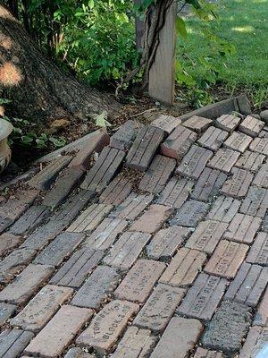 Heavy cement planter was knocked over.