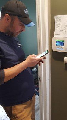 ADT tech installing and programming Lynx touch two-way system